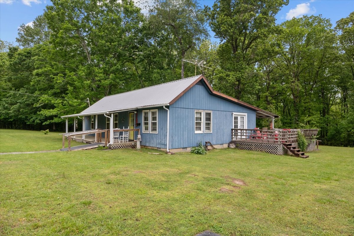 7158 Bahne Road Fairview, TN 37062 - Photo 35 of 37 a view of a house with a yard porch and sitting area