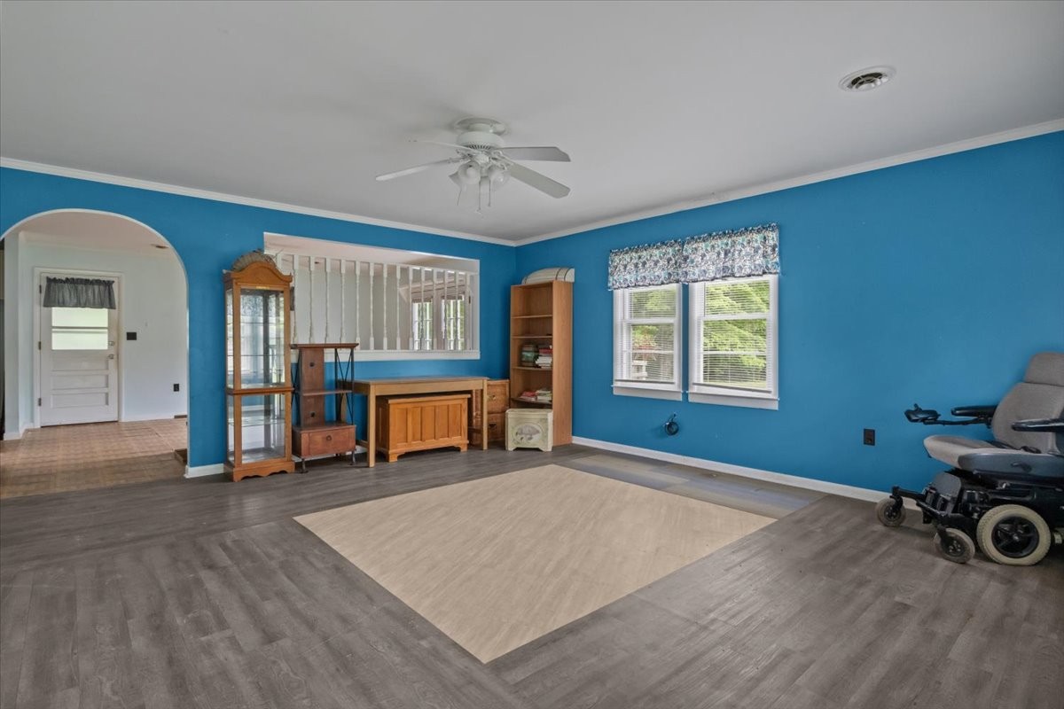 7158 Bahne Road Fairview, TN 37062 - Photo 6 of 37 a view of an empty room with window and wooden floor