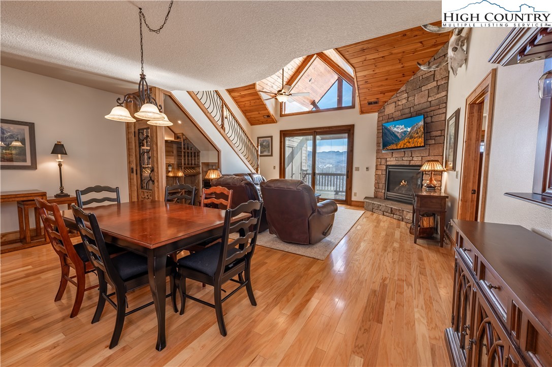 311 Penny Lane, Unit 2D Banner Elk, NC 28604 - Photo 11 of 38 a dining room with furniture and wooden floor