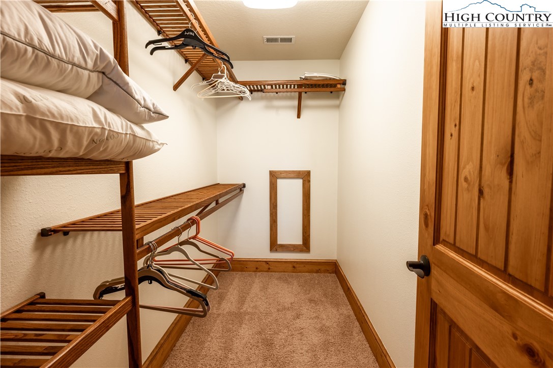 311 Penny Lane, Unit 2D Banner Elk, NC 28604 - Photo 30 of 38 a view of a room with gym equipment