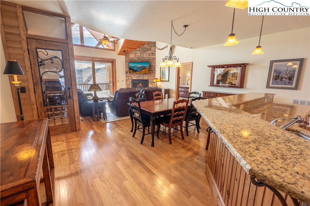 311 Penny Lane, Unit 2D Banner Elk, NC 28604 - Photo 4 of 38 a living room with furniture and wooden floor