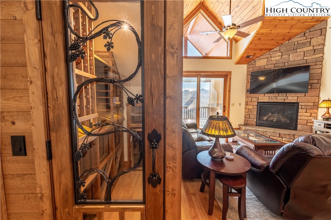 311 Penny Lane, Unit 2D Banner Elk, NC 28604 - Photo 7 of 38 a view of a livingroom with furniture and a fireplace