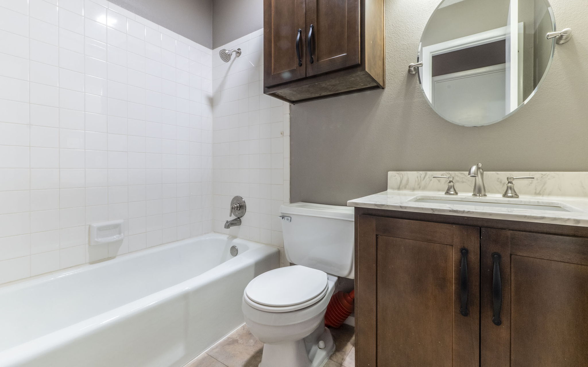 1007 Markham Lane, Unit A Austin, TX 78753 - Photo 11 of 15 a bathroom with a sink toilet and bathtub