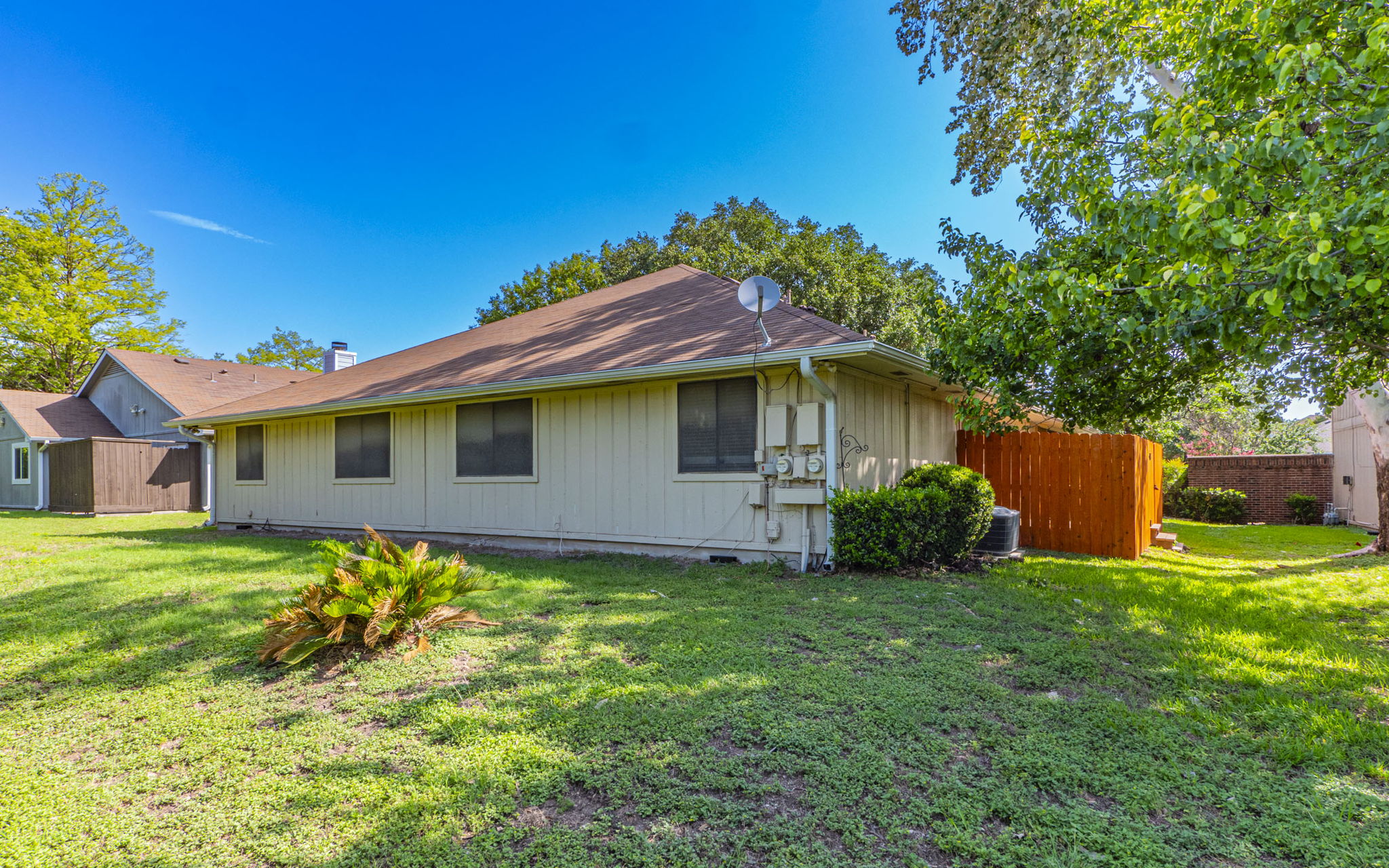 1007 Markham Lane, Unit A Austin, TX 78753 - Photo 14 of 15 a front view of a house with a yard