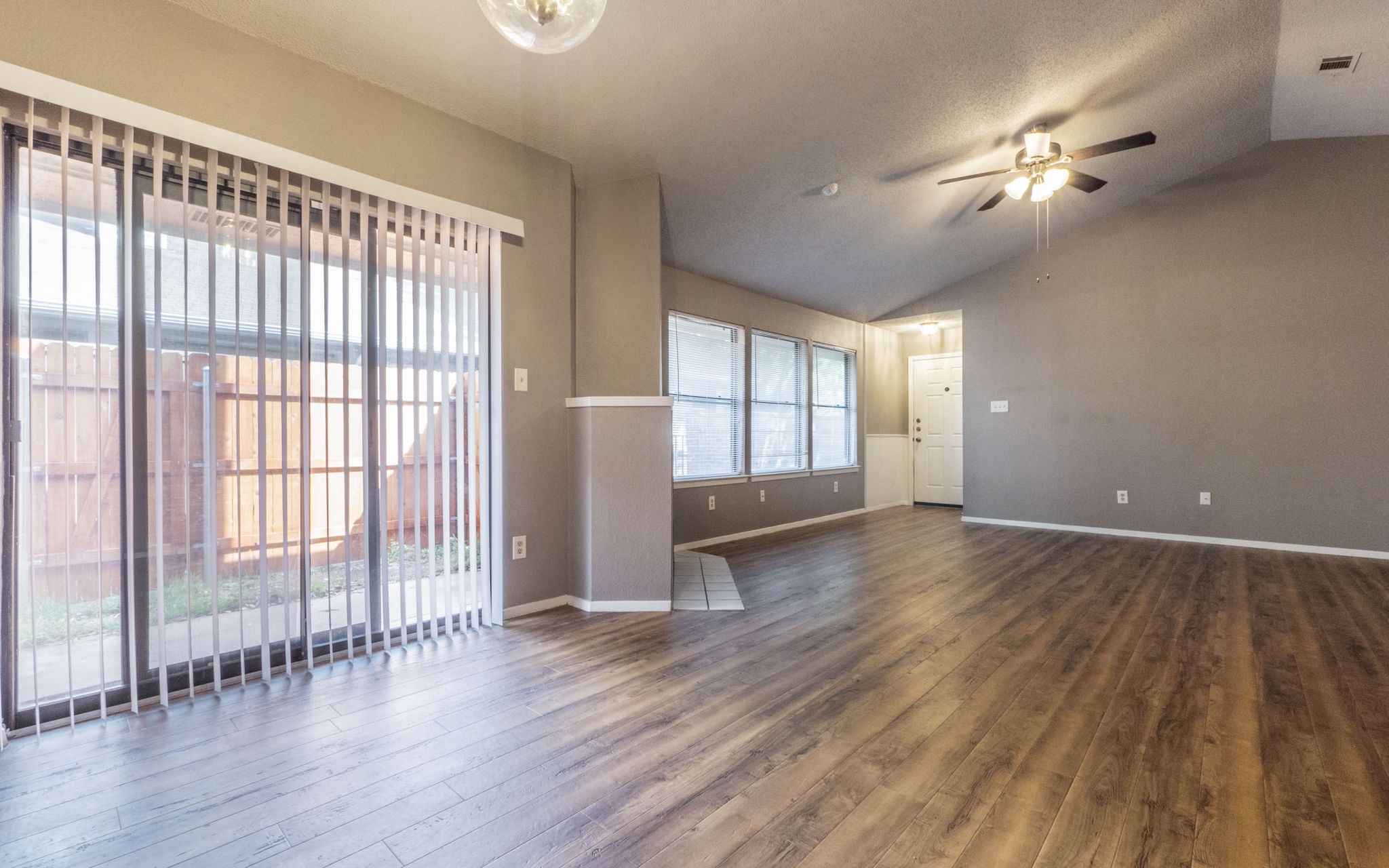 1007 Markham Lane, Unit A Austin, TX 78753 - Photo 2 of 15 wooden floor in an empty room with a window