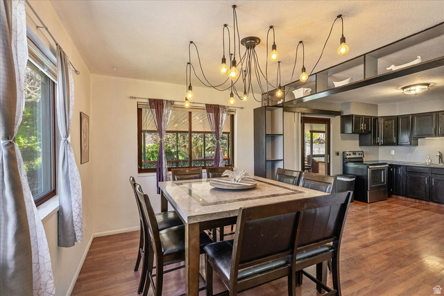 11 South Clark Lane Elk Ridge, UT 84651 - Photo 8 of 46 Dining space with dark wood finished floors and hanging lights