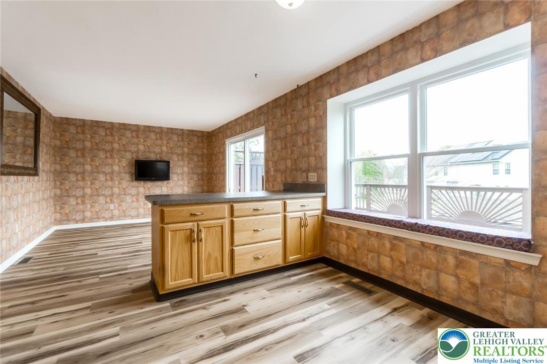 2226 Red Maple Drive Coplay, PA 18037 - Photo 15 of 69 a kitchen with stainless steel appliances a stove top oven cabinets a sink and a large window