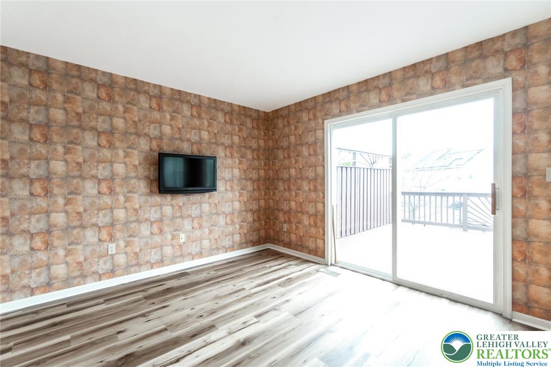 2226 Red Maple Drive Coplay, PA 18037 - Photo 18 of 69 a view of empty room with wooden floor and fan