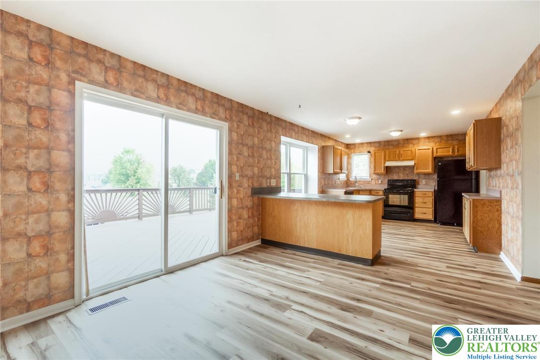 2226 Red Maple Drive Coplay, PA 18037 - Photo 19 of 69 a view of kitchen with kitchen island wooden floor center island and stainless steel appliances