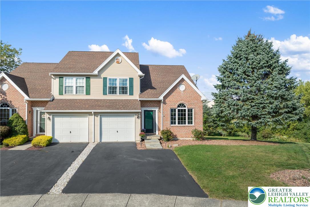 2226 Red Maple Drive Coplay, PA 18037 - Photo 2 of 69 a front view of a house with a yard and garage