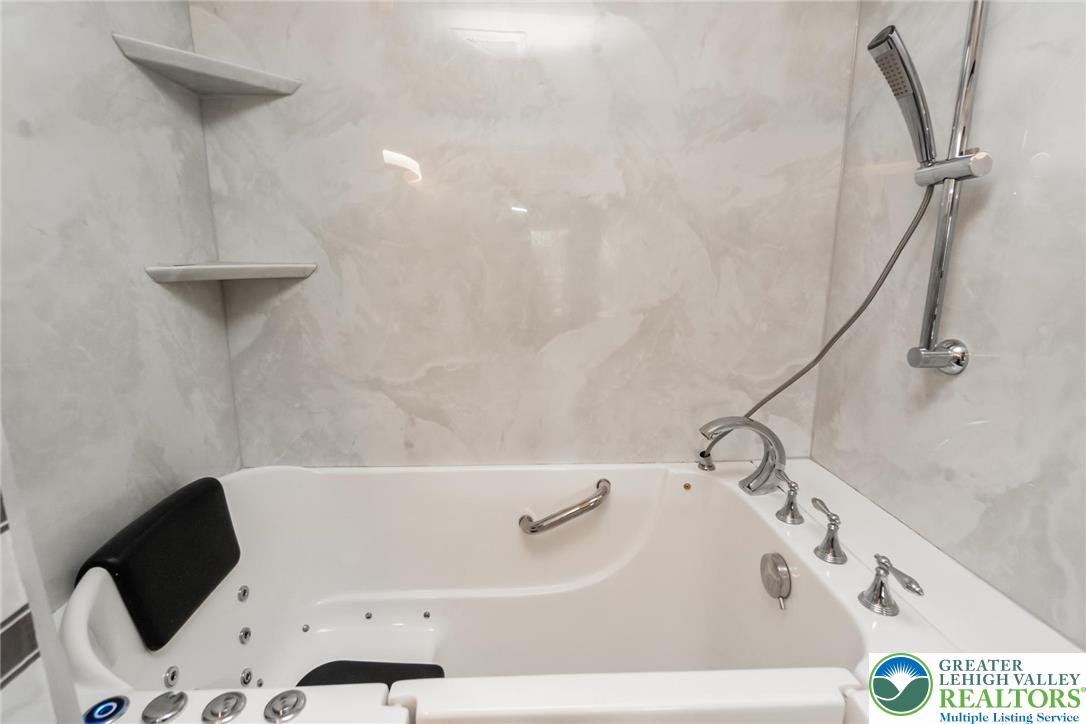 2226 Red Maple Drive Coplay, PA 18037 - Photo 29 of 69 a bathroom with a bathtub and a shower