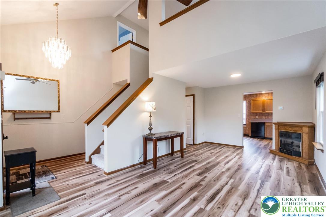 2226 Red Maple Drive Coplay, PA 18037 - Photo 3 of 69 a view of empty room with wooden floor and fan