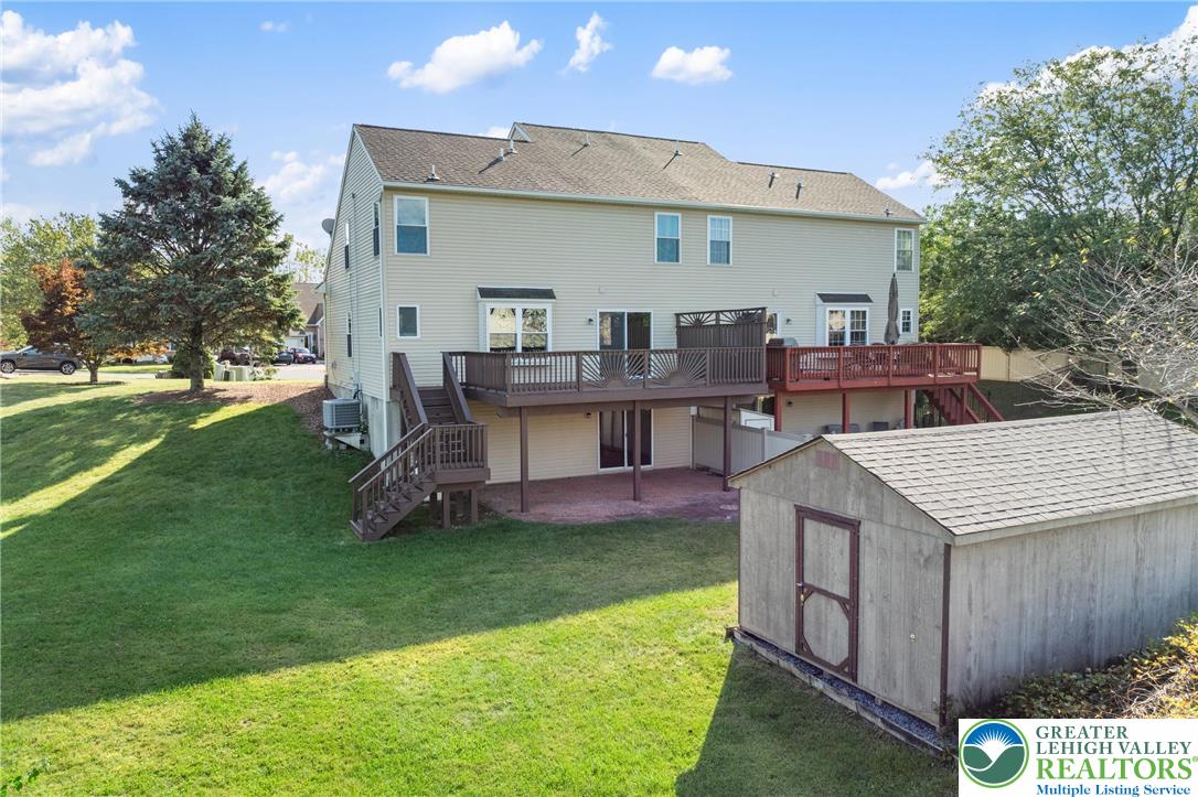 2226 Red Maple Drive Coplay, PA 18037 - Photo 44 of 69 a view of a house with a backyard and a patio