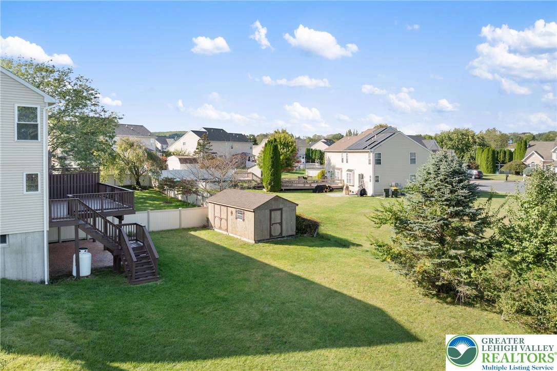 2226 Red Maple Drive Coplay, PA 18037 - Photo 47 of 69 a view of a house with a big yard potted plants and a palm tree
