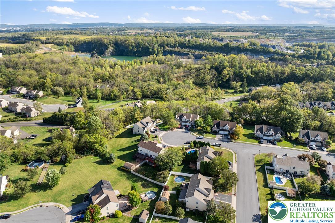 2226 Red Maple Drive Coplay, PA 18037 - Photo 54 of 69 an aerial view of a city with lots of residential buildings and lake view