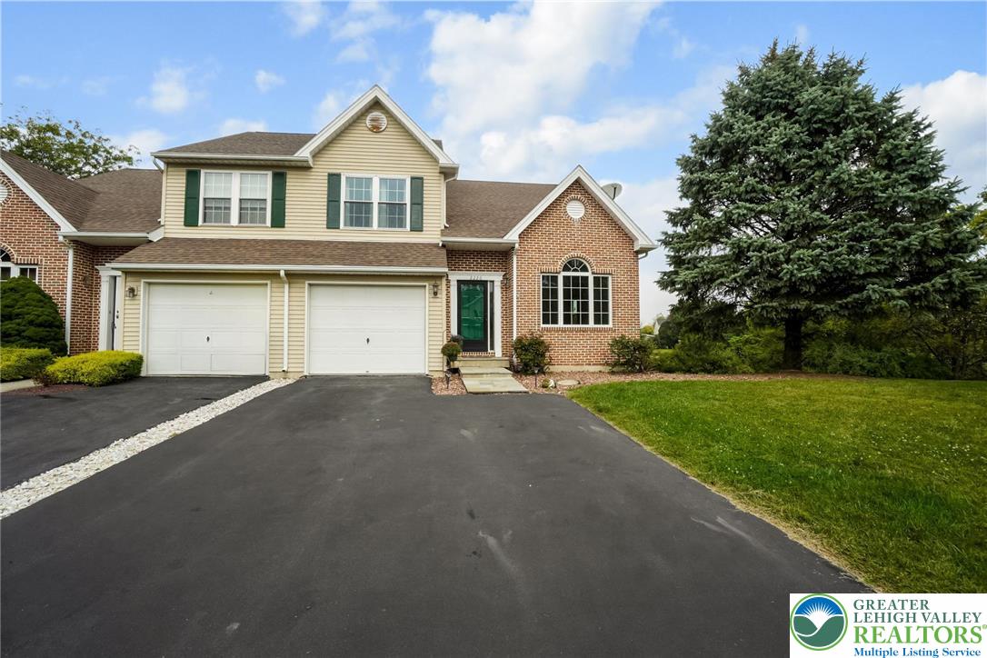 2226 Red Maple Drive Coplay, PA 18037 - Photo 62 of 69 a front view of a house with a yard and garage