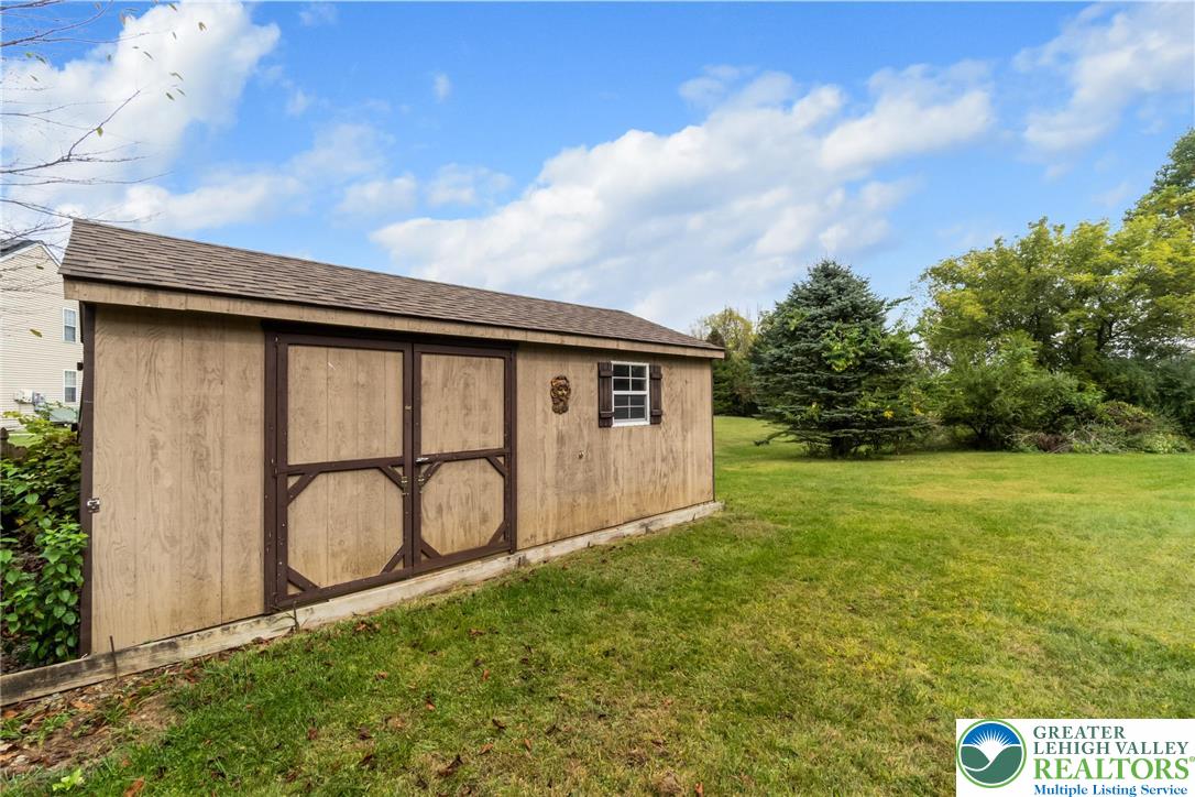 2226 Red Maple Drive Coplay, PA 18037 - Photo 69 of 69 a backyard of a house with table and chairs