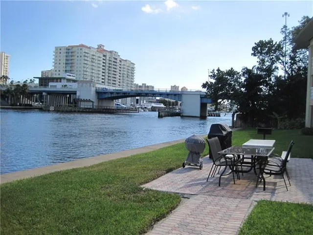 a view of a patio with a table and chairs