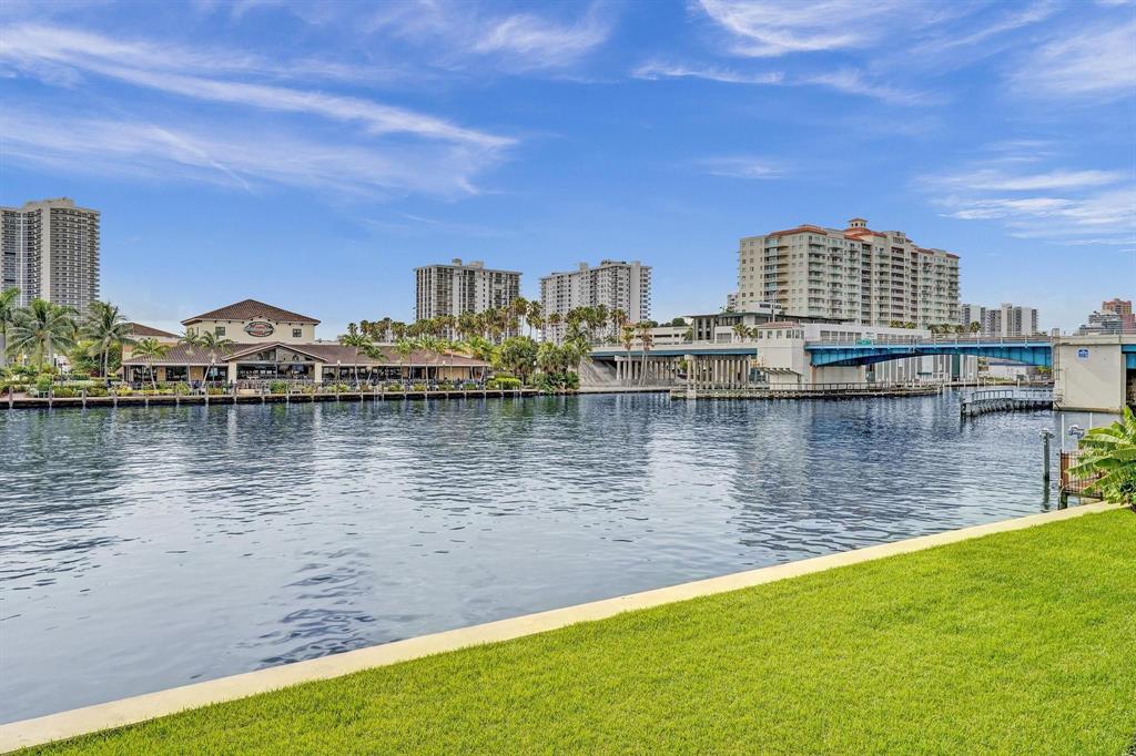 2895 Northeast 32nd Street, Unit 206 Fort Lauderdale, FL 33306 - Photo 19 of 22 a view of a lake with tall buildings
