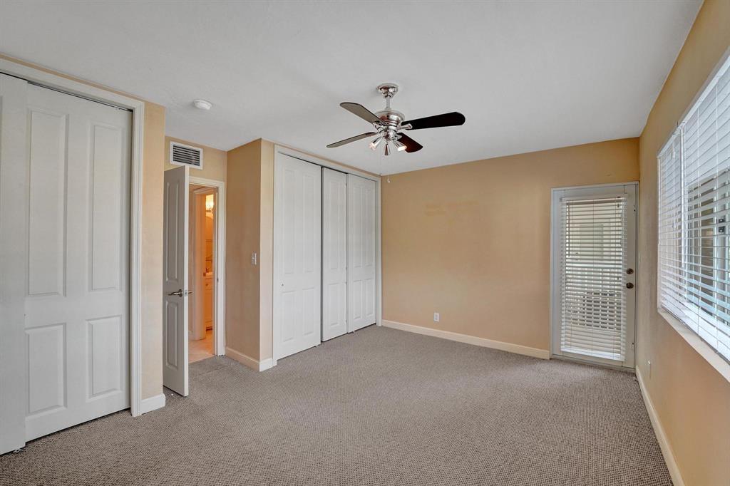 2895 Northeast 32nd Street, Unit 206 Fort Lauderdale, FL 33306 - Photo 7 of 22 a view of an empty room with a window