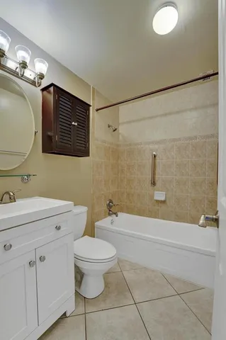 a bathroom with a toilet a sink and bathtub