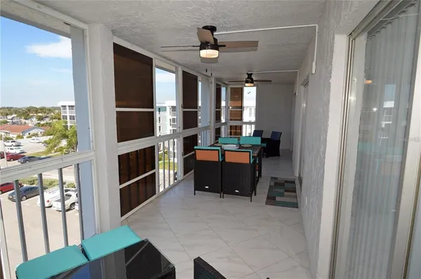 a bedroom with a bed chandelier and a mirror