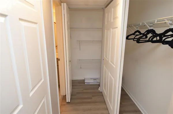 a view of a room with a table and chairs