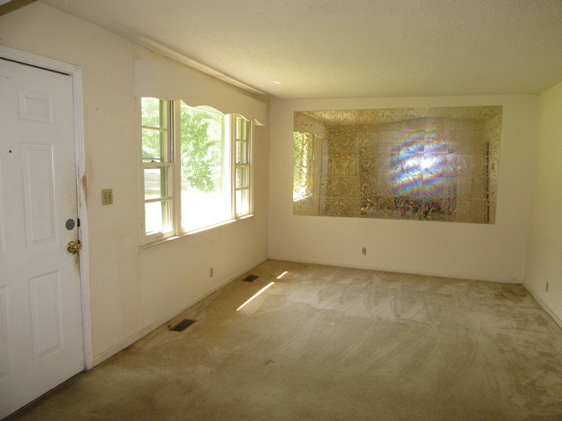 107 Jay Circle Clarksville, TN 37040 - Photo 4 of 12 a view of an empty room with wooden floor and a window