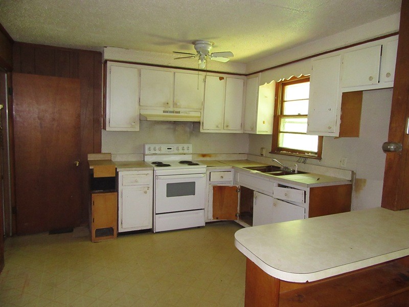 107 Jay Circle Clarksville, TN 37040 - Photo 7 of 12 a kitchen with a stove sink and cabinets