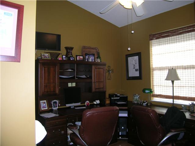2927 Southeast Racoon Way Stuart, FL 34997 - Photo 13 of 22 a living room with furniture and a flat screen tv