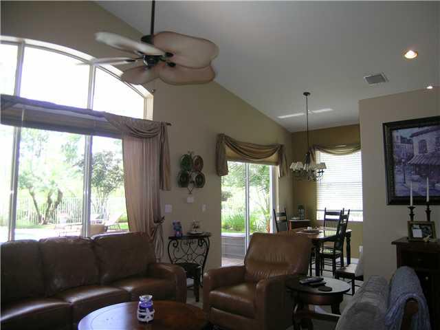 2927 Southeast Racoon Way Stuart, FL 34997 - Photo 5 of 22 a living room with furniture and a large window