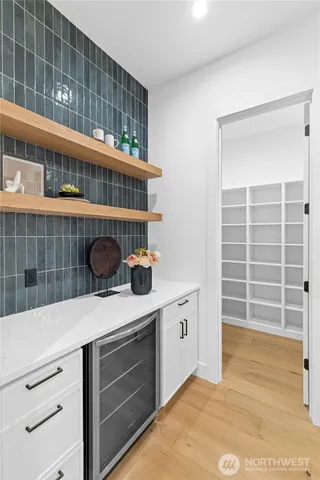 a kitchen with a stove and a cabinets