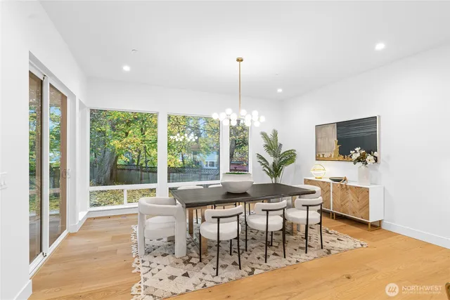 a view of a dining room with furniture window and wooden floor