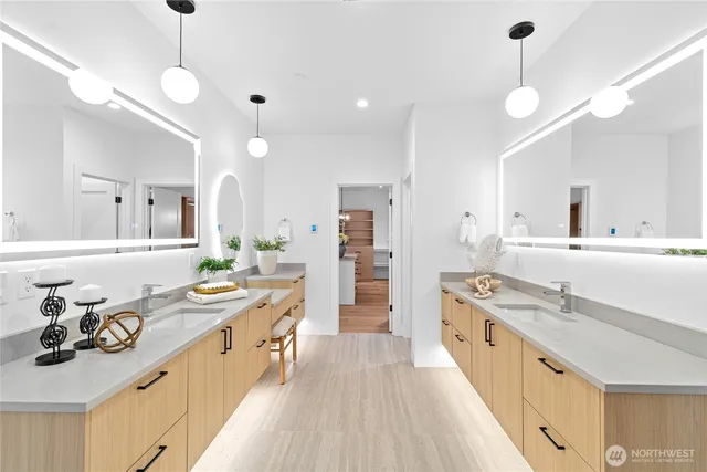 a large kitchen with kitchen island a stove a sink a refrigerator and a dining table view