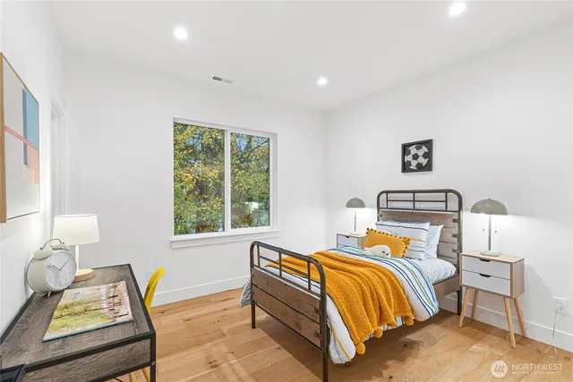 a bedroom with bed and a window