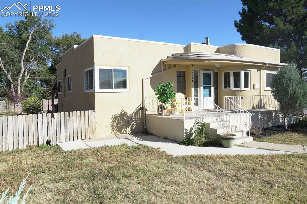 2906 High Street Pueblo, CO 81008 - Photo 1 of 25 a front view of a house with a garden