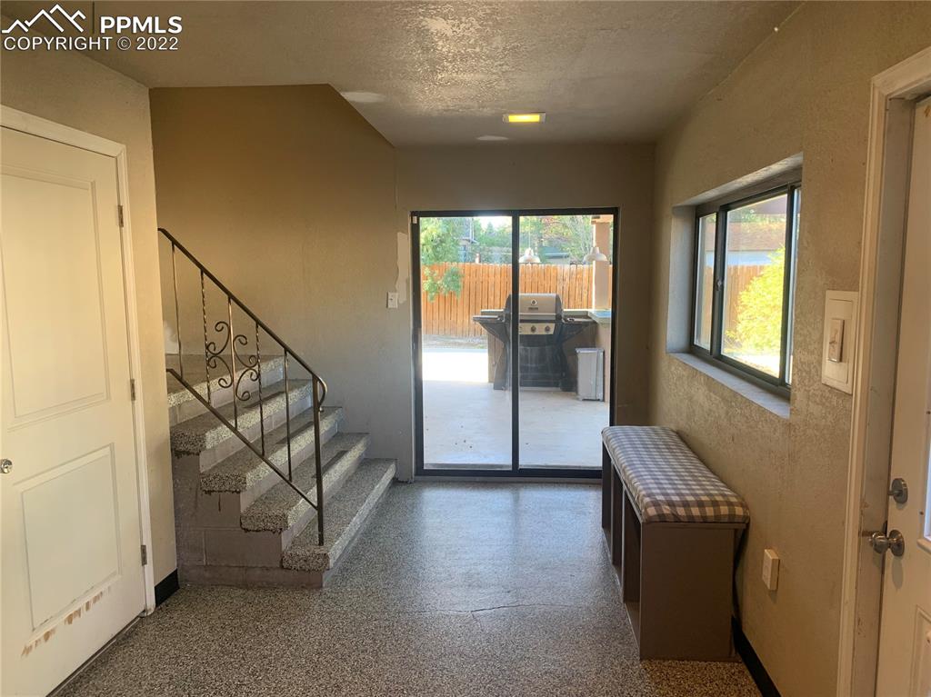 2906 High Street Pueblo, CO 81008 - Photo 12 of 25 a view of an entryway with wooden floor and door