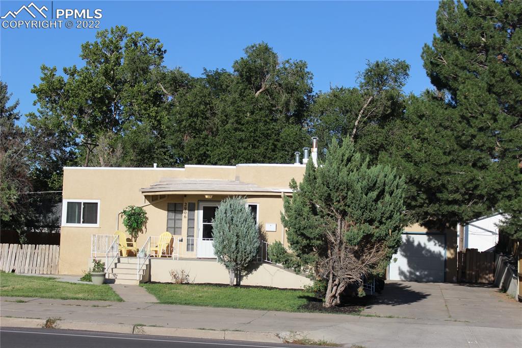 2906 High Street Pueblo, CO 81008 - Photo 2 of 25 a front view of a house with garden