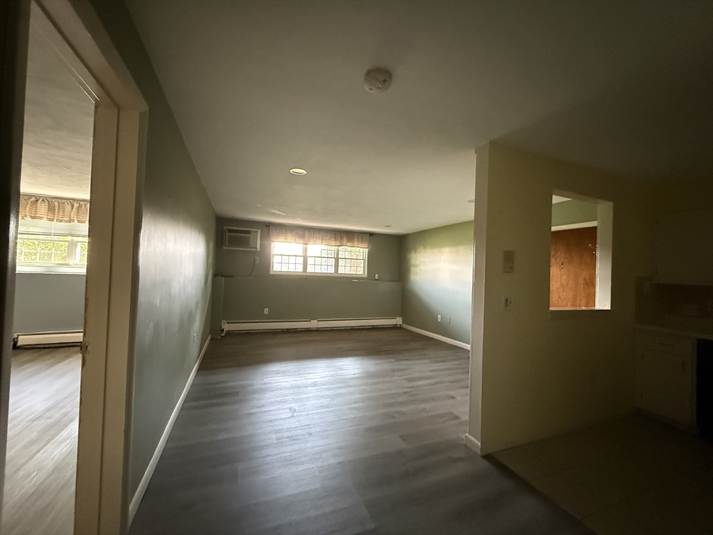 12 Williamsburg Court, Unit 2 Shrewsbury, MA 01545 - Photo 14 of 36 a view of hallway with wooden floor