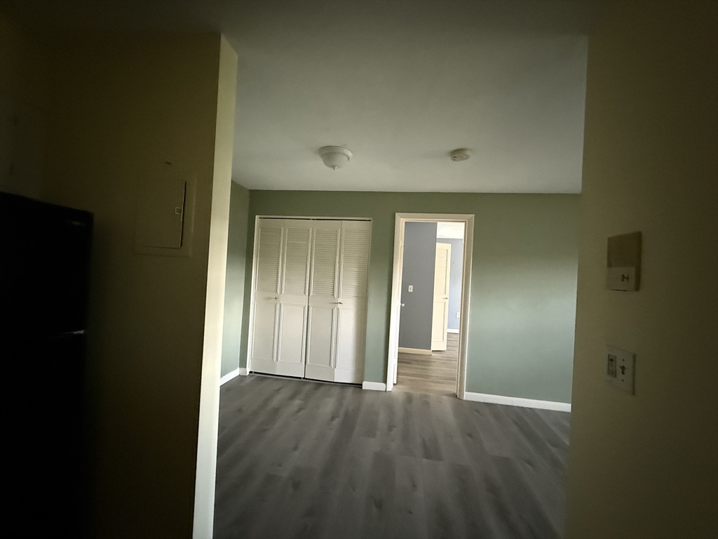 12 Williamsburg Court, Unit 2 Shrewsbury, MA 01545 - Photo 20 of 36 wooden floor in an empty room