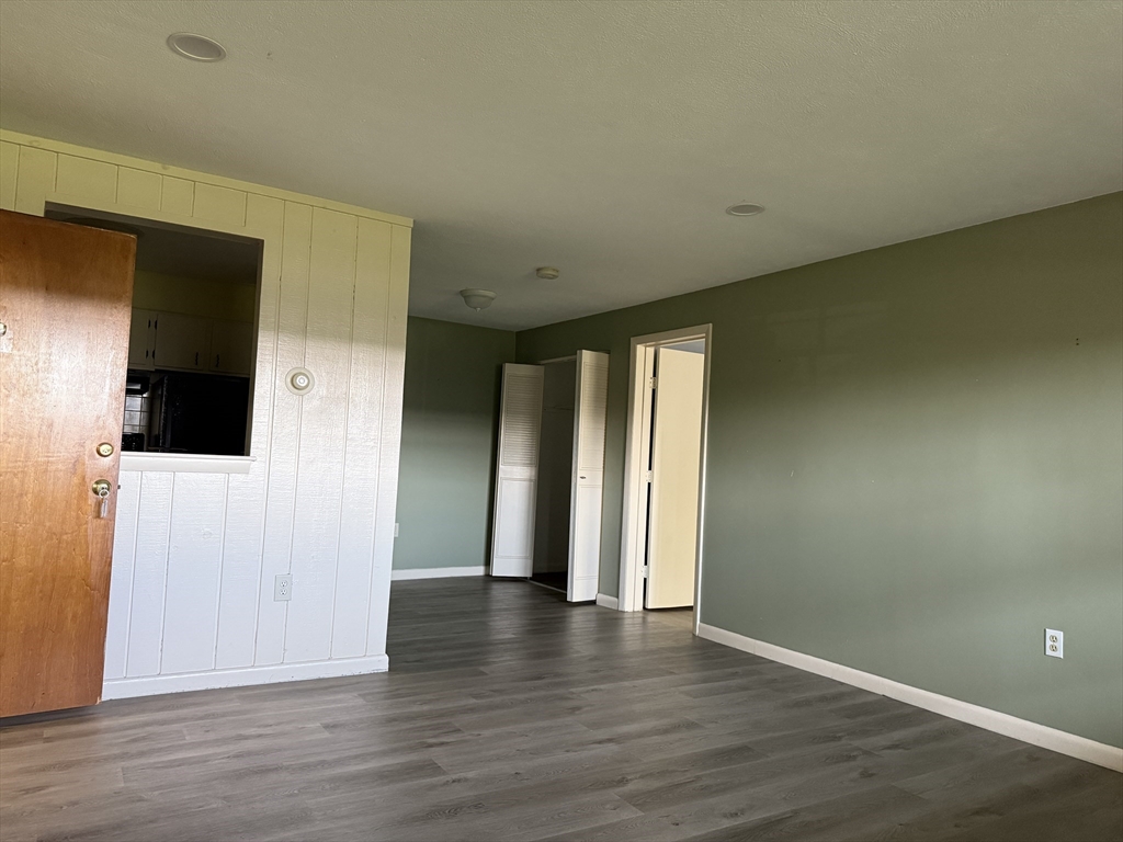 12 Williamsburg Court, Unit 2 Shrewsbury, MA 01545 - Photo 32 of 36 a view of hallway with wooden floor