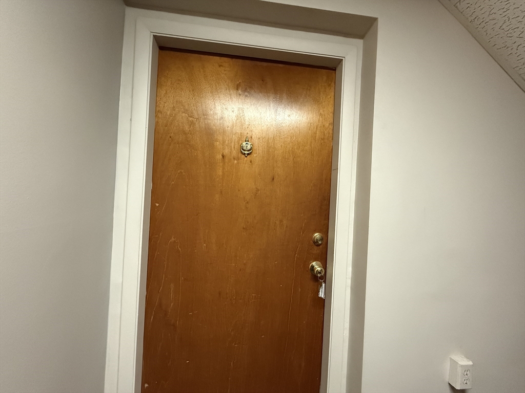 12 Williamsburg Court, Unit 2 Shrewsbury, MA 01545 - Photo 4 of 36 a view of an entryway door