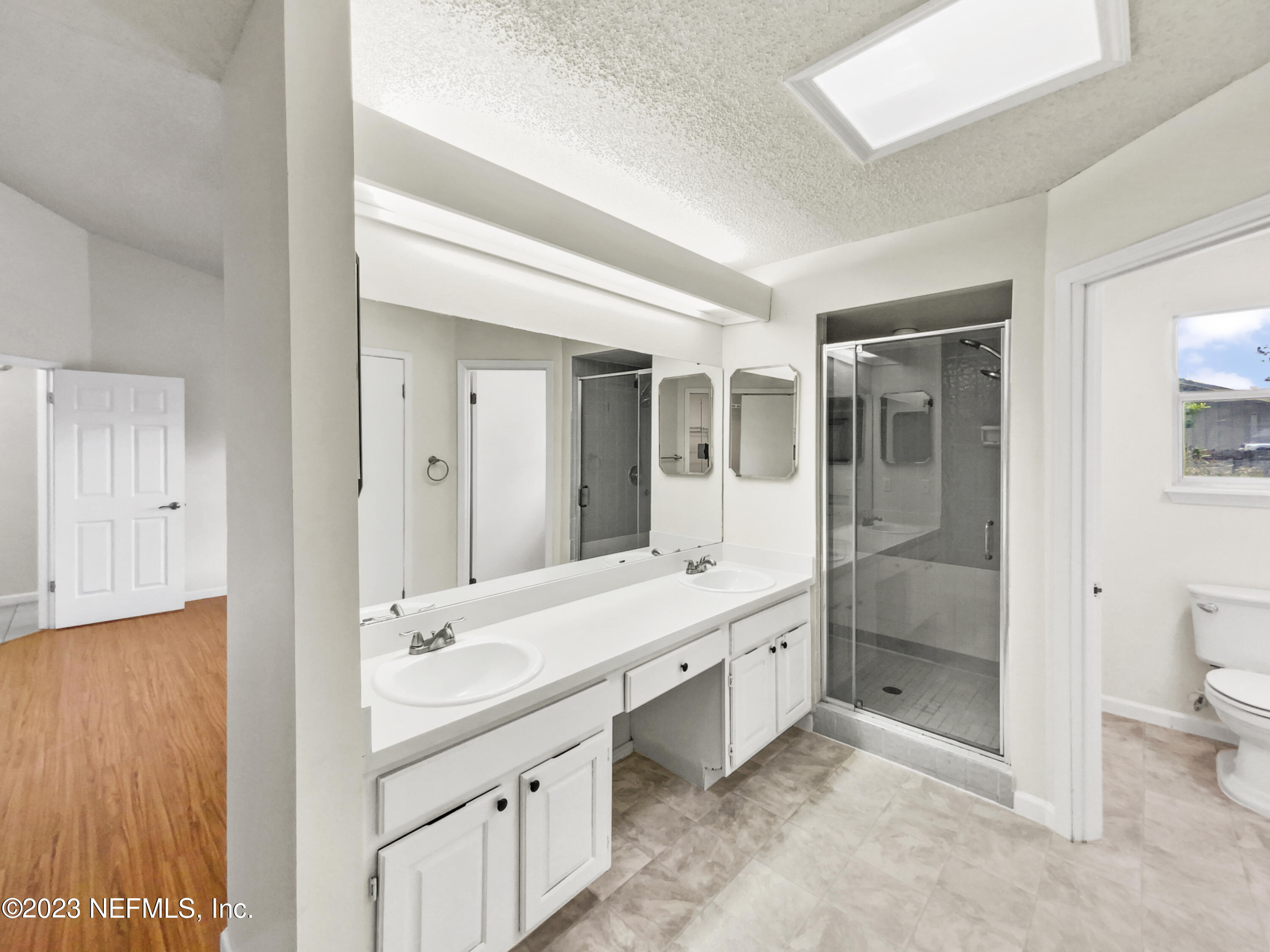 3550 Loretto Road Jacksonville, FL 32223 - Photo 14 of 19 a bathroom with a double vanity sink mirror and toilet