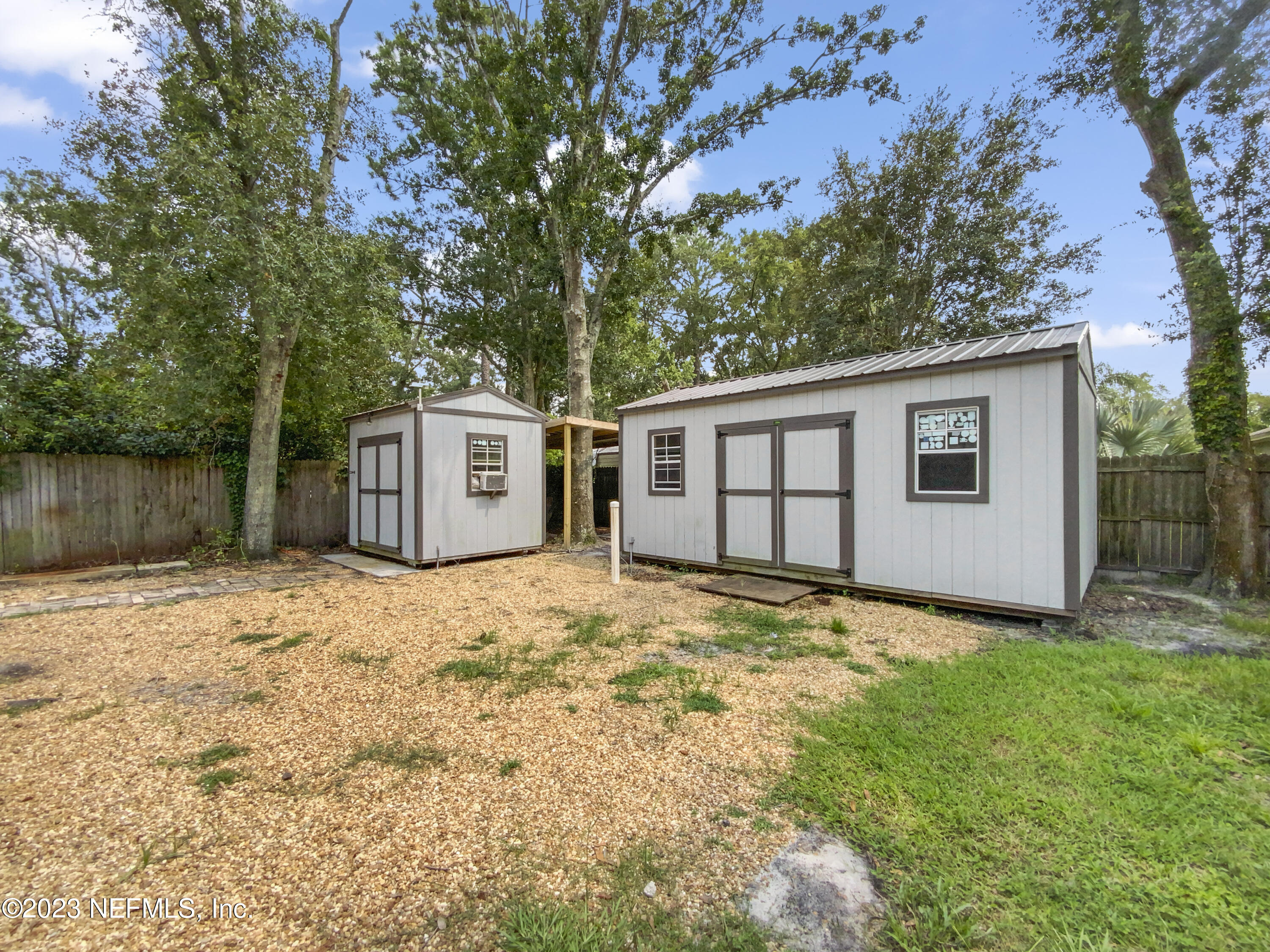 3550 Loretto Road Jacksonville, FL 32223 - Photo 19 of 19 a front view of a house with a yard and garage