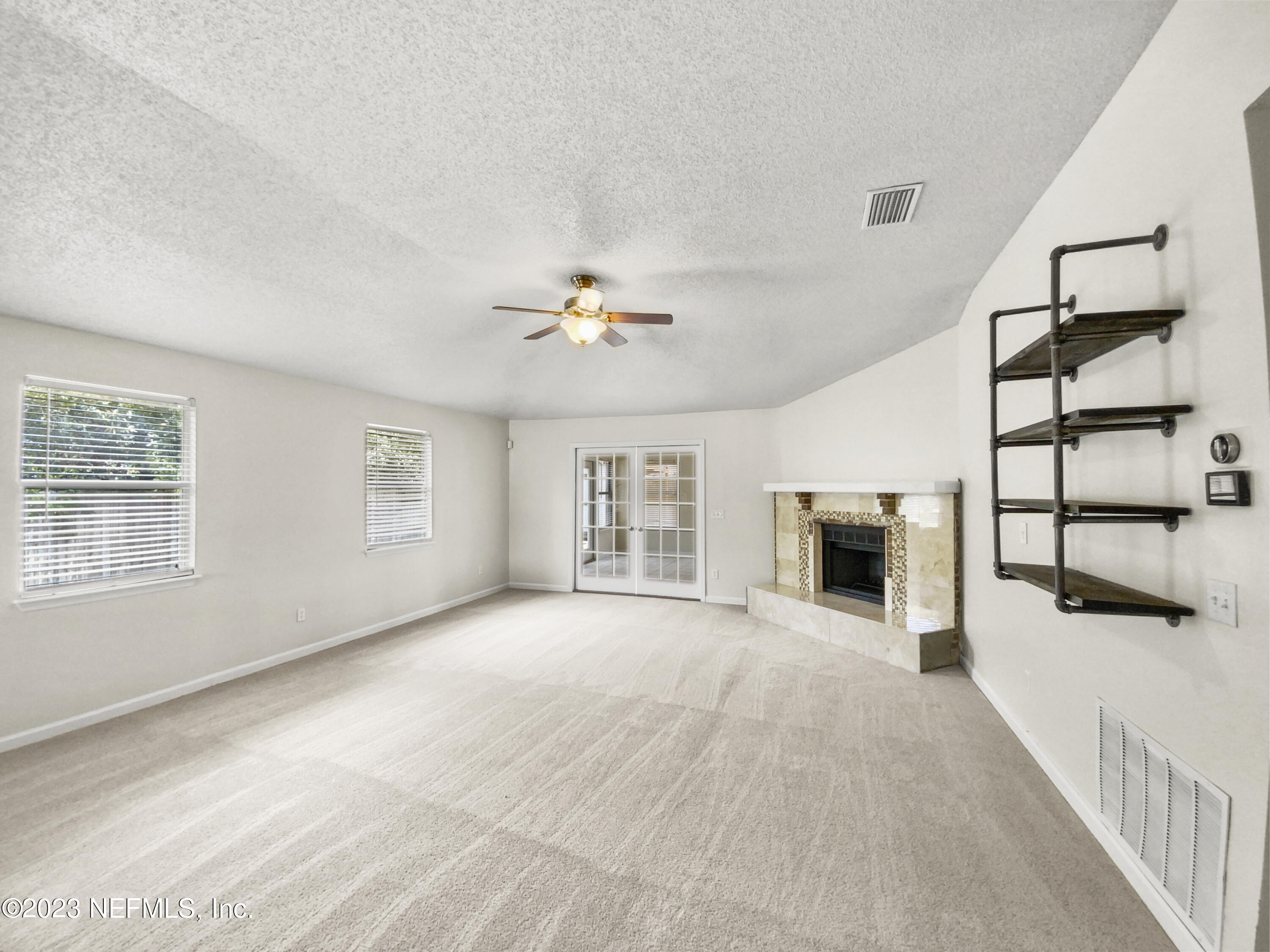 3550 Loretto Road Jacksonville, FL 32223 - Photo 2 of 19 a view of a livingroom with a ceiling fan and window