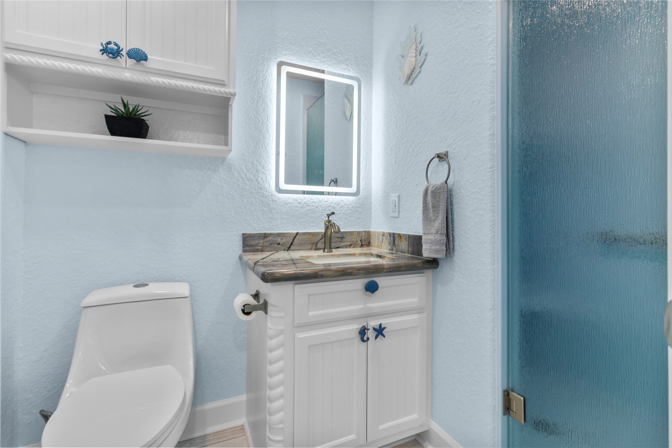 622 Fin Alley Surfside Beach, TX 77541 - Photo 31 of 33 Luxury Brazilian Quartzite countertop and LED lighted mirrors in both bathrooms.