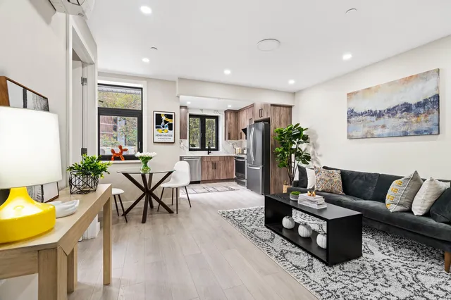 a living room with furniture and a rug