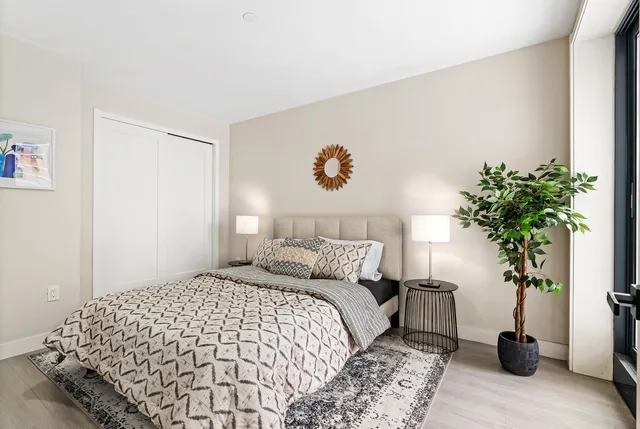 a kitchen with stainless steel appliances white cabinets and a refrigerator