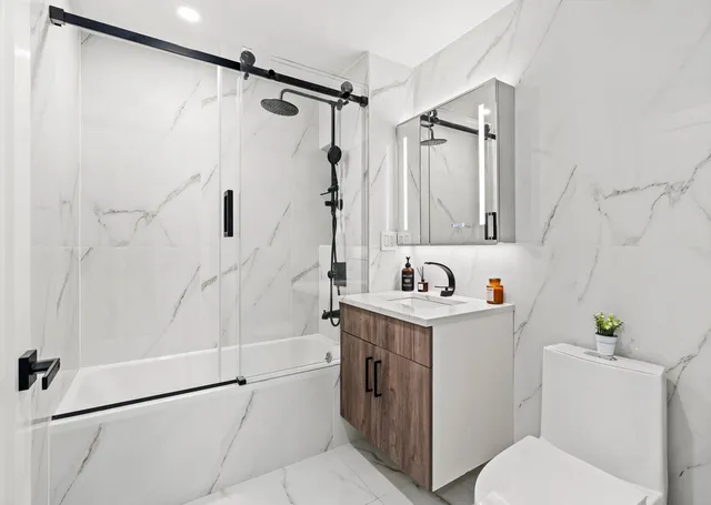 a bedroom with a large bed and a large window