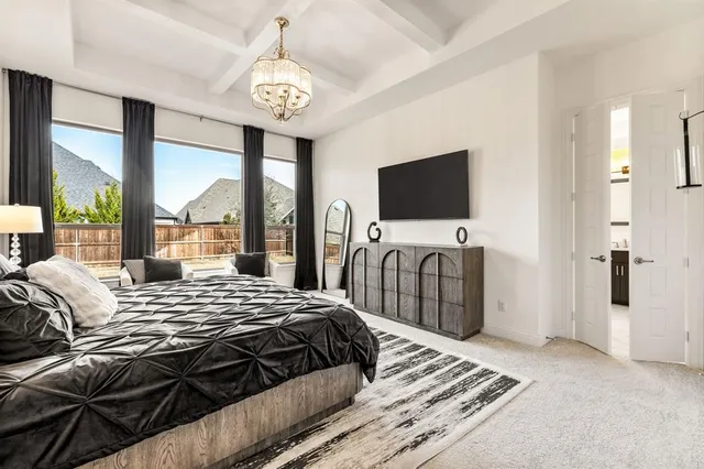 a bedroom with a bed and glass walk in closet